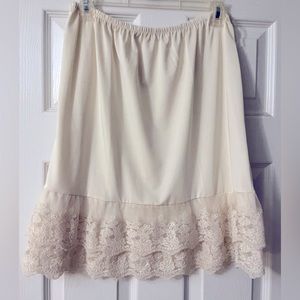 Size S cream colored elastic slip with lace detailing from Altar’d State.